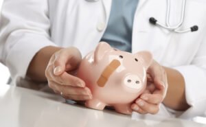 doctor holding a piggy bank on hands