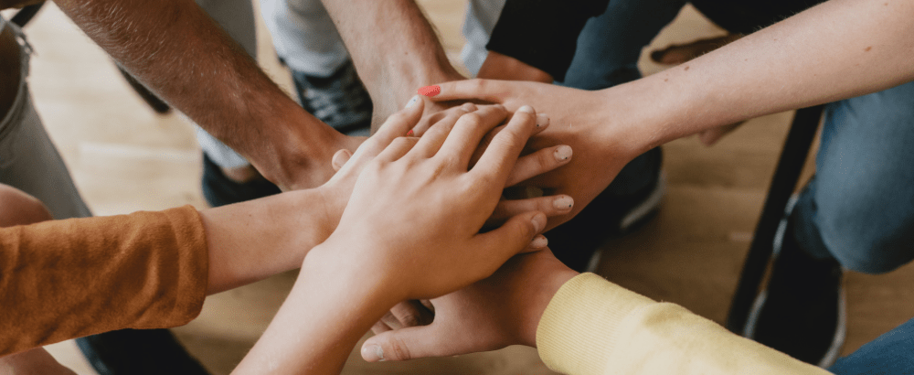 Bunch of people keeping their hands together