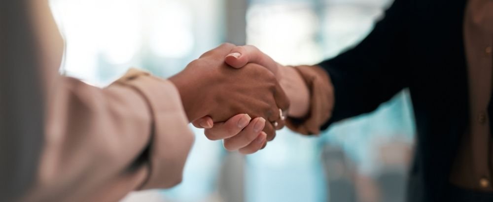 two teammates are shaking hands